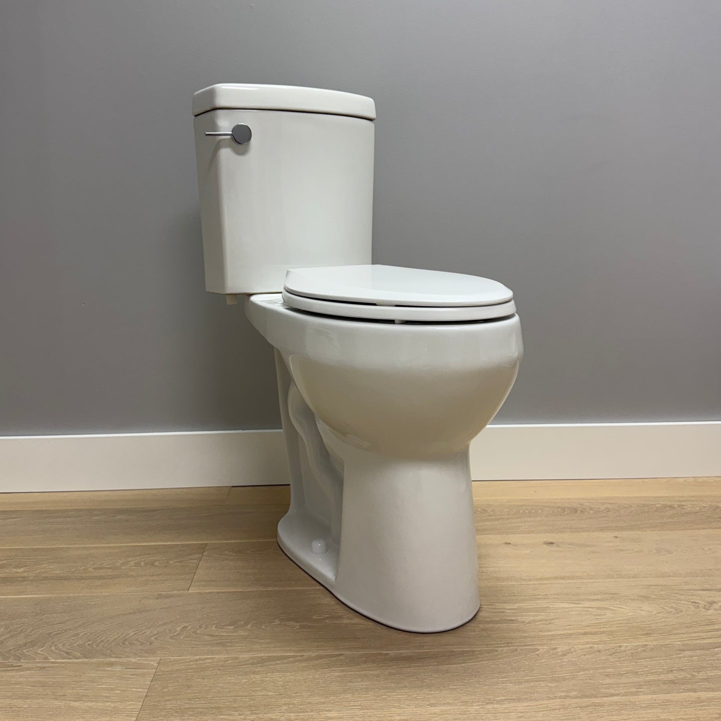 21 inch Extra Tall toilet against helps to sit down and stand up easier