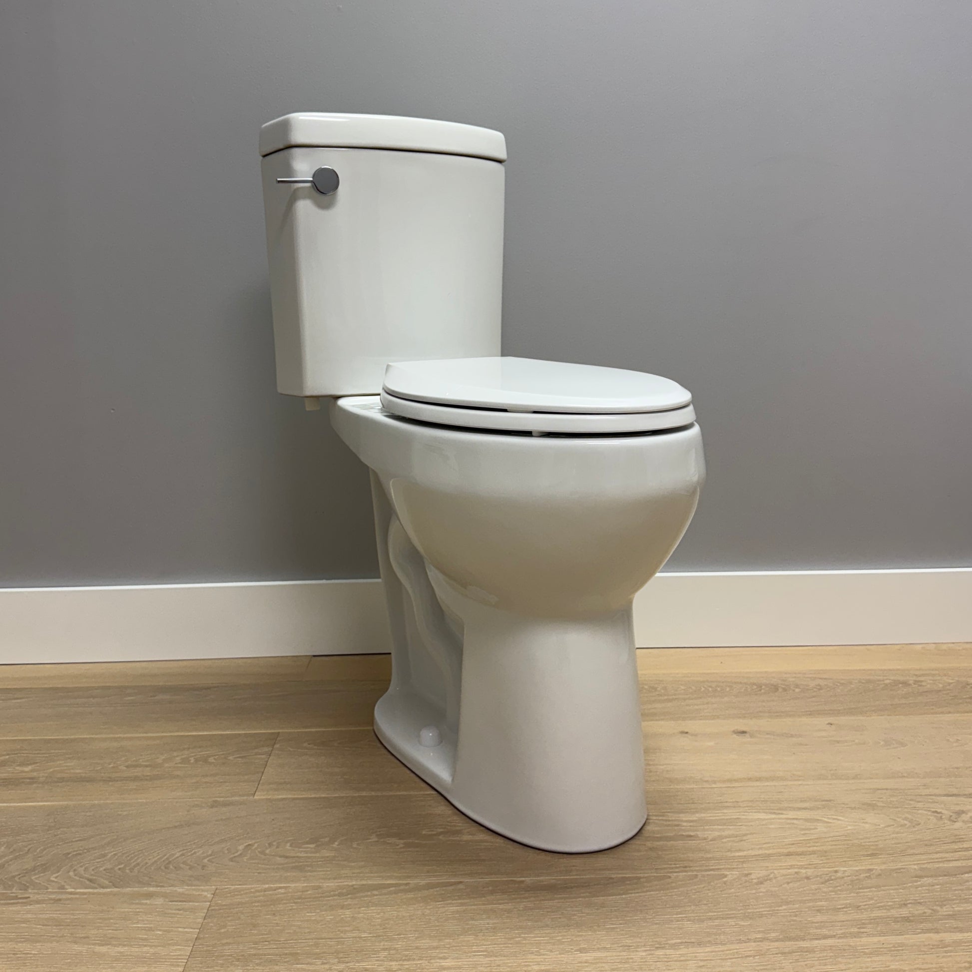 21 inch Extra Tall toilet against helps to sit down and stand up easier