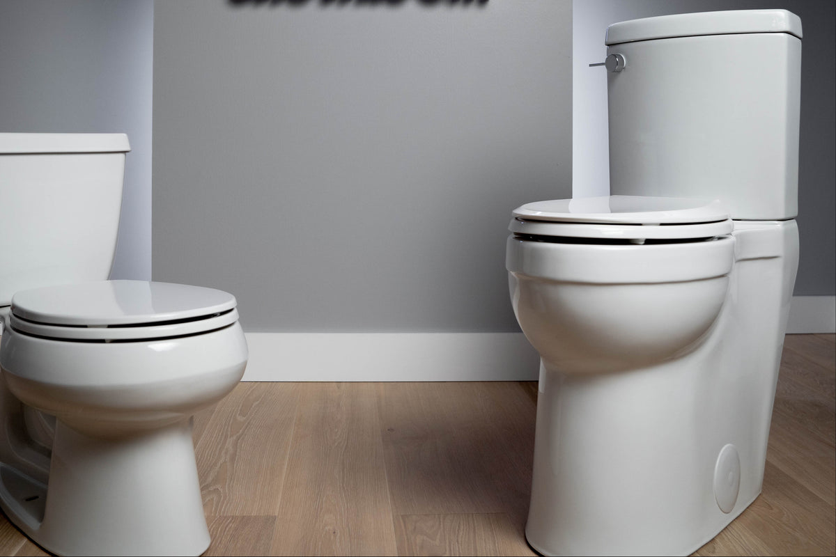 ide by side comparison of a standard 15 inch toilet next to a Convenient Height 21 inch extra tall toilet with 22 seat height