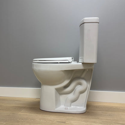 White toilet with artistic design on a gray wall background