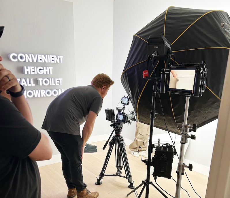 The creative production team is recording a new product video at the Convenient Height HQ Tall Toilet Showroom in Charlotte, North Carolina.