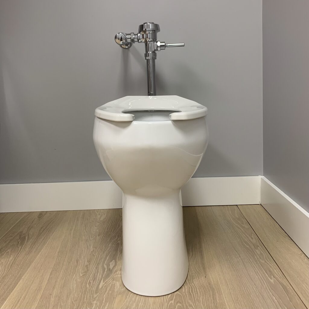 Commercial bowl measures 21.25 inch from floor to the top of the toilet seat